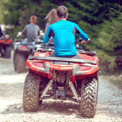ATV riders in motion wearing protective attire showing what to wear on atv tour correctly