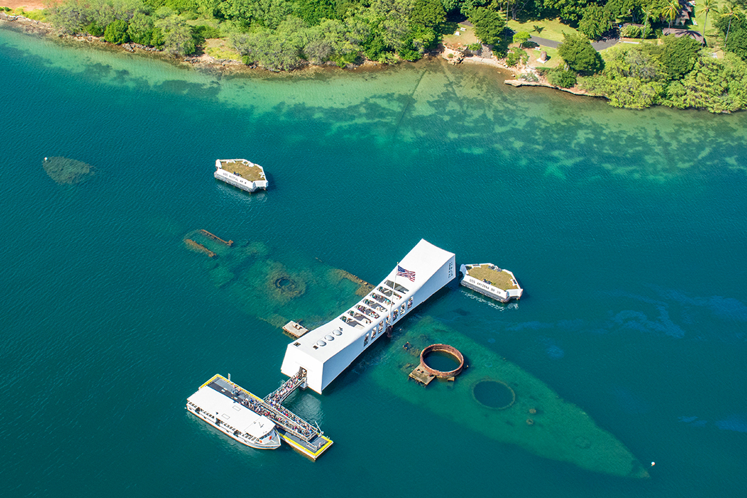 An aerial photo of the USS Arizona memorial at Pearl Harbor
